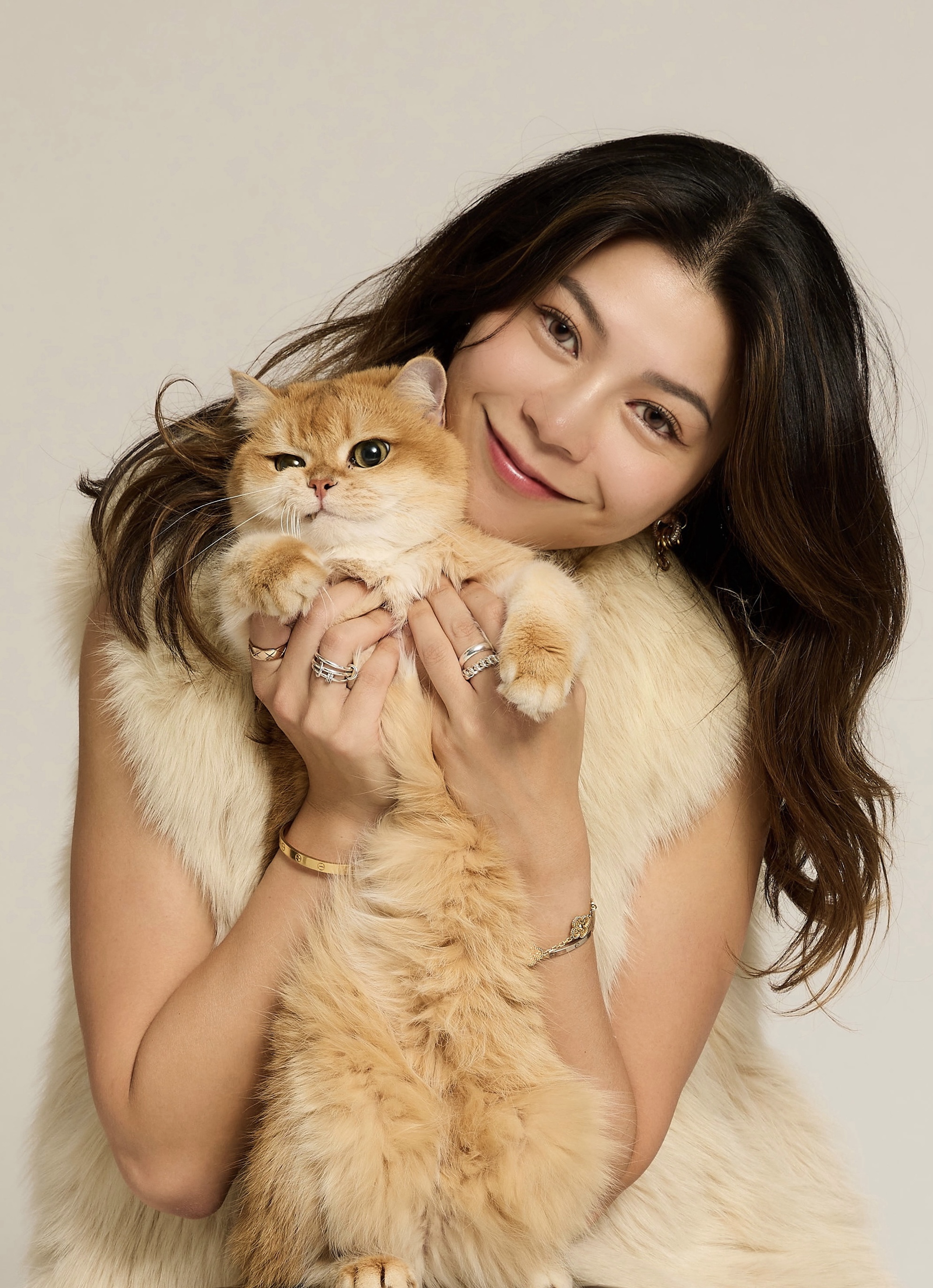 Laura holding Ernie, a golden British Shorthair